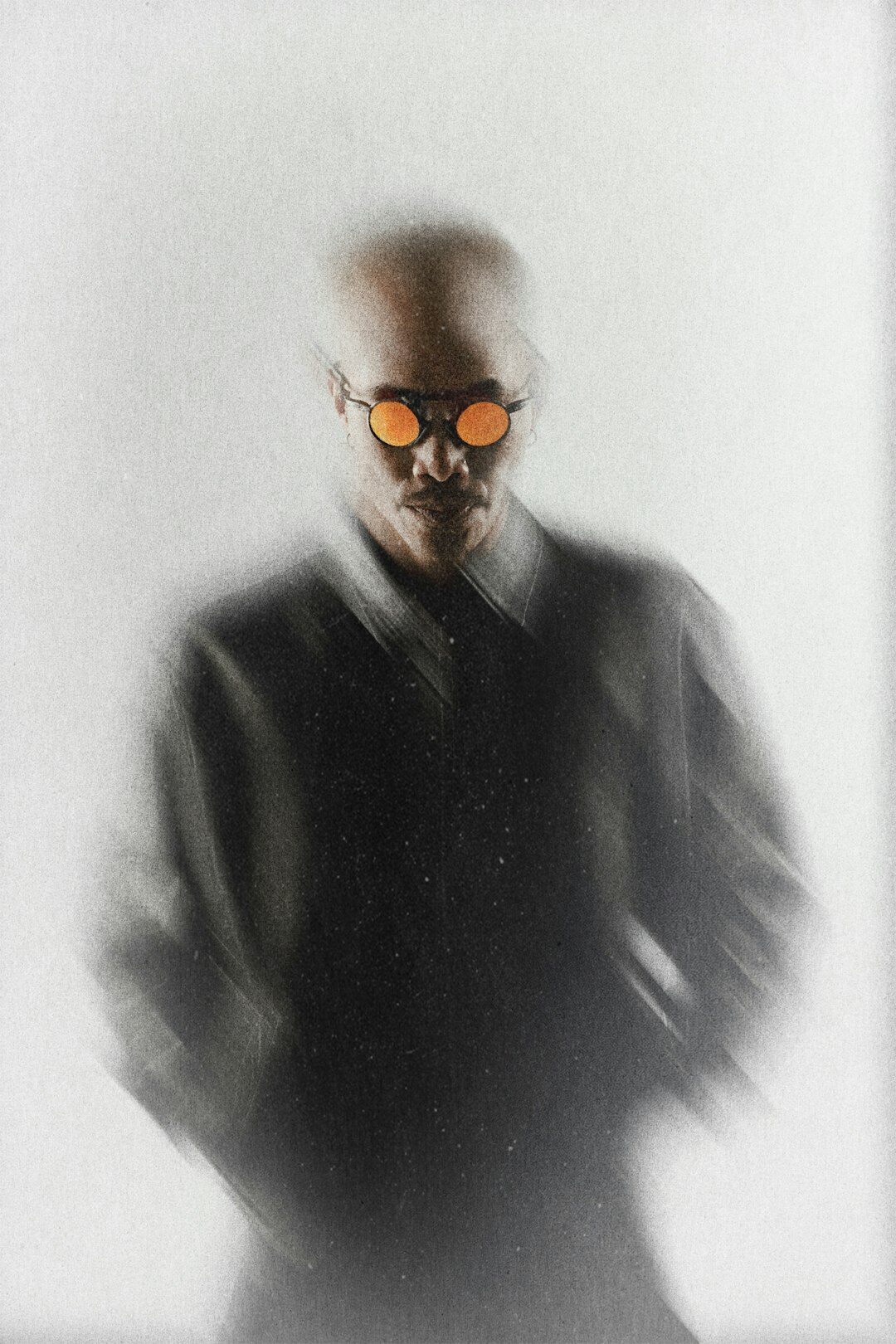 Studio portrait of an older Scandinavian man photographer with grey hair and glasses