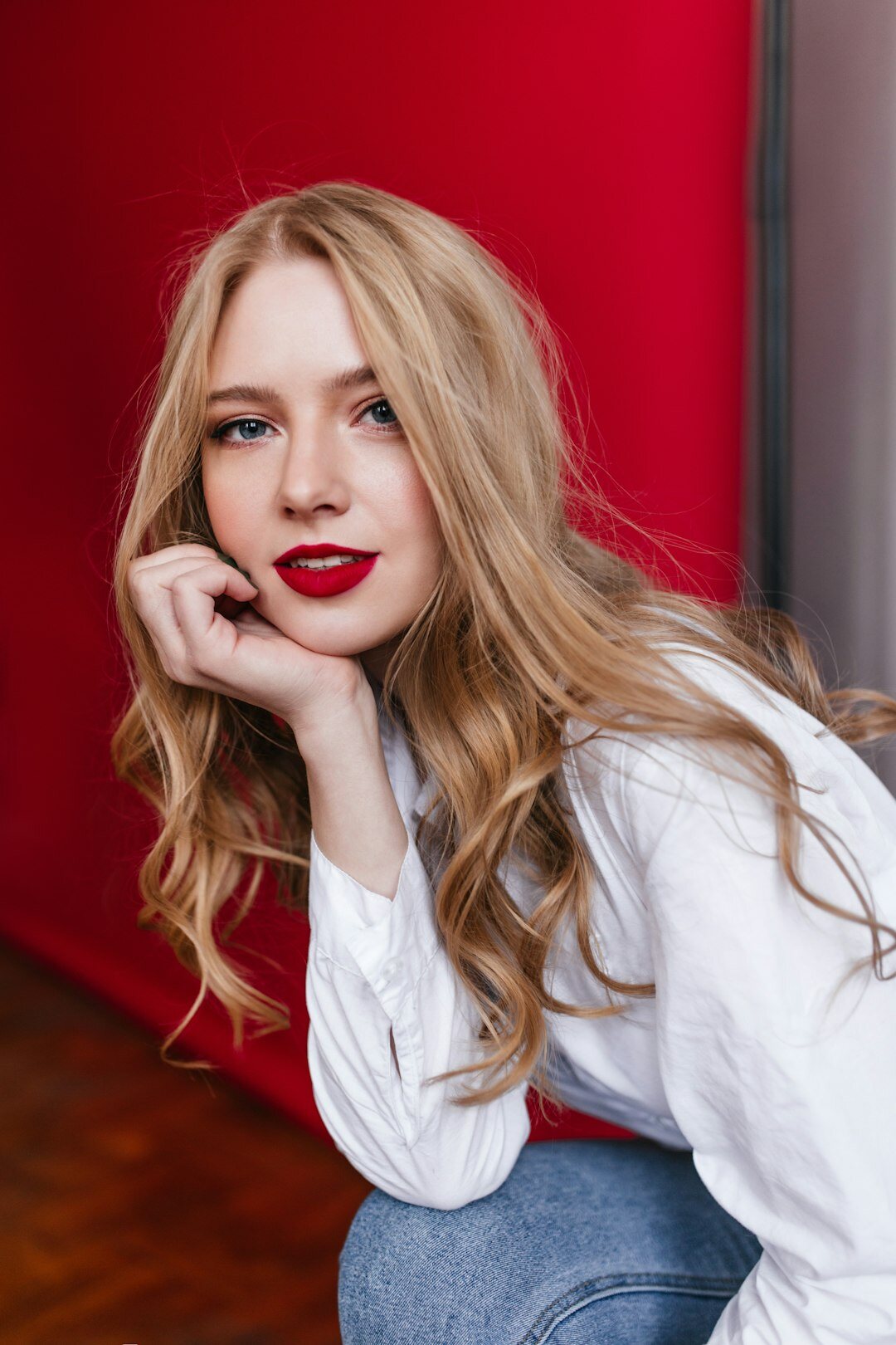 Studio portrait of a young Scandinavian woman photographer with short blonde hair